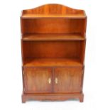 A reproduction Regency style yew wood dwarf open fronted bookcase,