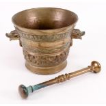 A bronze pestle and mortar, cast around the sides with an inscription and a pilgrimage,