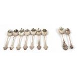 A collected set of seven silver golf club teaspoons, various dates and makers,