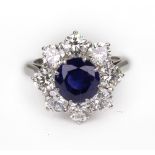 A modern sapphire and diamond cluster ring,