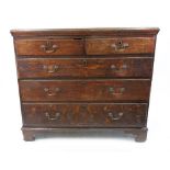 A mid 18th century oak chest, the moulded rectangular top above two short and three long drawers,