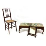A reproduction early 18th century style mahogany fender stool, with tapestry seat, on cabriole legs,