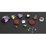A collection of gem stones, comprising; a round light-brown,