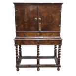 A William & Mary walnut crossbanded and oyster walnut isometric inlaid cabinet,