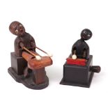 Two carved wooden Japanese Kobi toys, both playing percussion instruments,