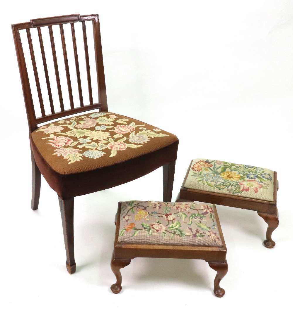 Two reproduction mahogany footstools, in early 18th century style, with tapestry seats,