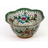 A small plique a jour bowl, of flowerhead shape, on a gilt metal rim foot,