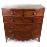 A late George III mahogany bowfront chest,