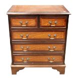 A reproduction George III style mahogany crossbanded boxwood strung chest,