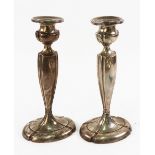 A pair of American candlesticks, detailed sterling, in George III style, with vase shape sconces,
