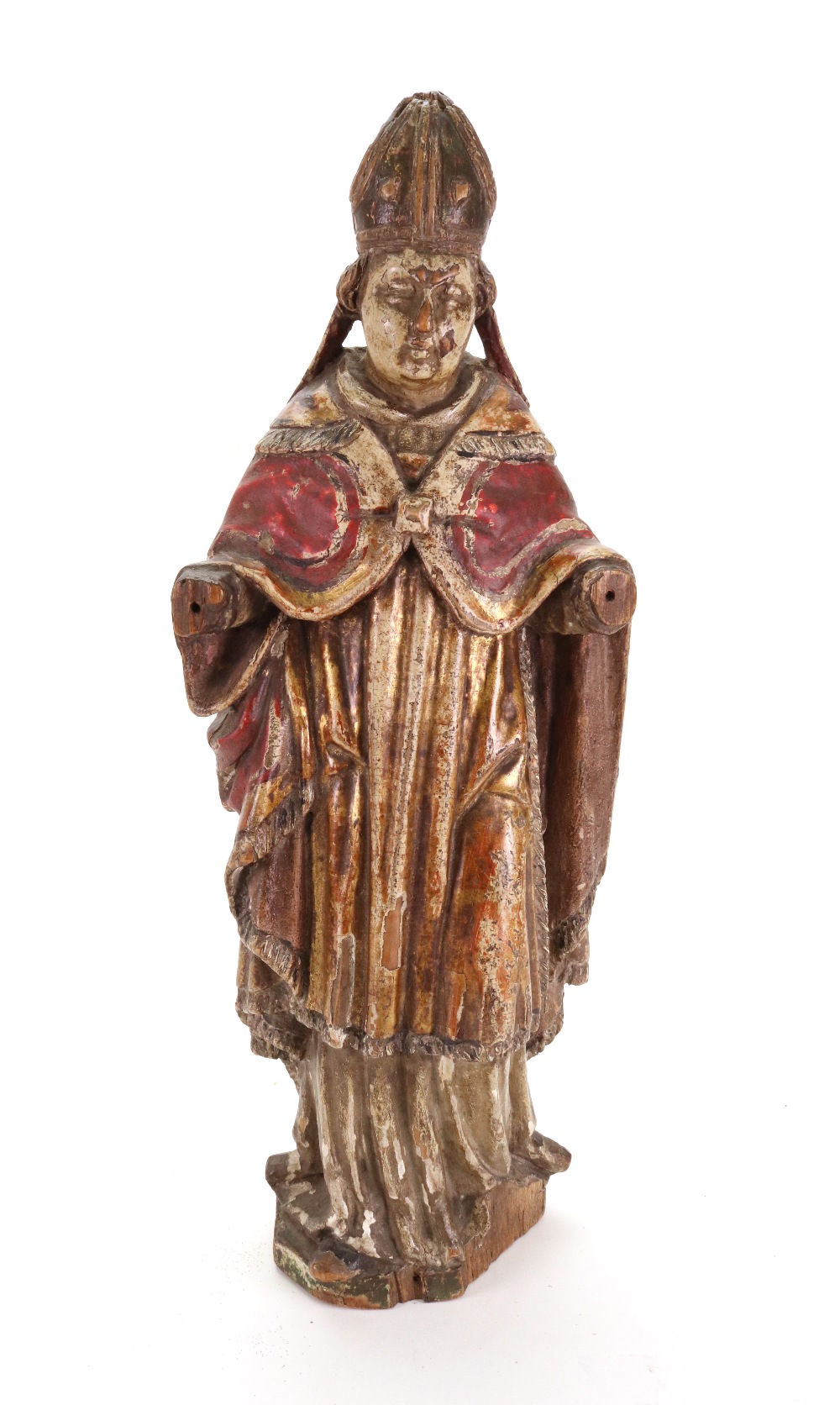 A carved gilded and polychrome decorated figure of a standing Bishop, 17th/18th century, 41cm high.