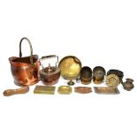 A set of three reproduction brass fire tools, two others, two copper coal helmets,