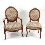 A Louis XV style walnut gilt metal mounted fauteuil and matching side chair, circa 1870,
