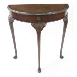 A reproduction mid 18th century style carved walnut demi lune console table, with frieze drawer,