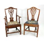 Five George III country elm and mahogany dining chairs, in Hepplewhite style,