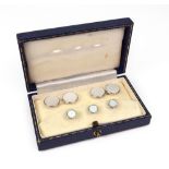 A cased set of 9ct white gold and mother of pearl cufflinks and dress buttons, by Cropp & Farr, 11.