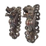 A pair of Chinese carved lacquered wooden figures of dragons, late 19th century,