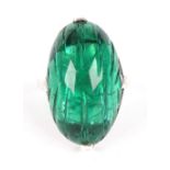 A French cabochon carved green paste ring, the large oval paste four-claw set in white gold, size L,