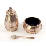 An Arts & Crafts silver salt cellar, pepperette and salt spoon, Walker & Hall, Sheffield 1913,