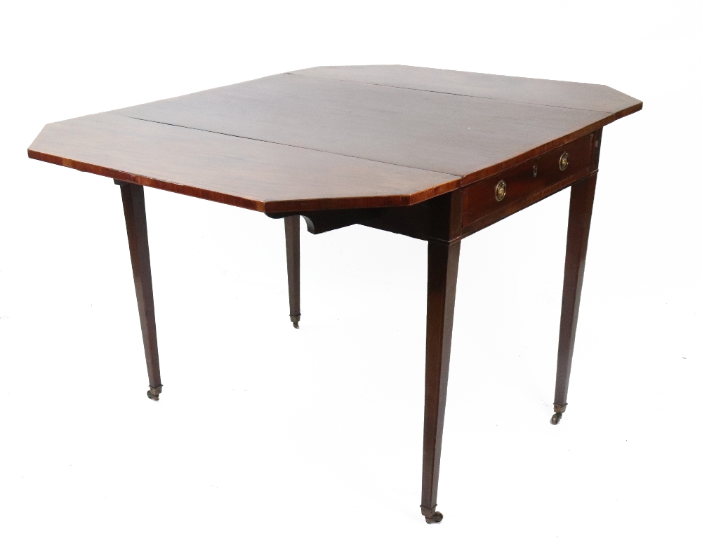 A George III mahogany tulipwood crossbanded boxwood and ebony strung Pembroke table,