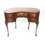 A reproduction mid 18th century style burr walnut and crossbanded kidney shape kneehole desk,