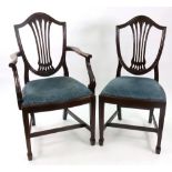A set of eight reproduction Hepplewhite style mahogany dining chairs,