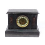 A Victorian black slate marble mantel clock, the twin train movement striking on a gong, 32cm wide.