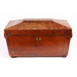A Regency mahogany boxwood strung sarcophagus shape tea caddy, with cut-brass roundels,