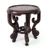 A Chinese rosewood vase stand, late 19th/early 20th century, with dished circular top,