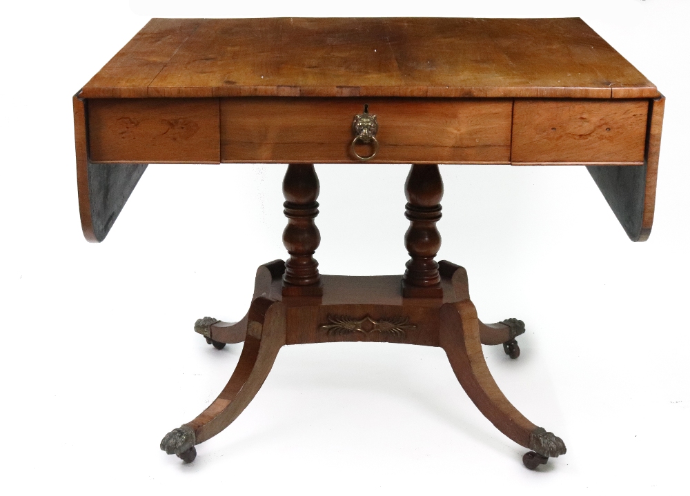 A Regency rosewood sofa table, with single frieze drawer, hinged drop leaves,