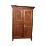 A French Provincial Louis XVI style carved walnut and parcel gilt armoire, 19th century,