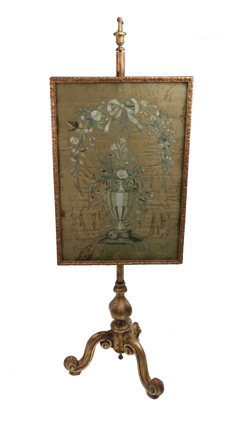 A Victorian giltwood pole screen, circa 1860, with hexagonal pillar and scrolled tripod base,