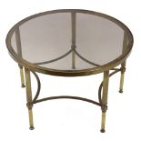 A modern brass frame circular glass top coffee table, on reeded legs, 61.