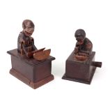 Two carved Japanese Kobi toys, one of a man eating a melon,