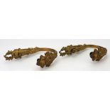 A pair of French gilt metal curtain tie backs, late 19th century, cast with acanthus,