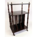 An early Victorian rosewood three tier whatnot, with cast brass finials,