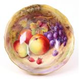 A Royal Worcester shaped circular bowl, painted with fruit by T Lockyer, 20cm diameter.
