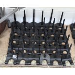 Thirty modern ebonised plate stands, with turned tapering supports, 20cm high.
