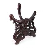 A large Chinese carved rosewood plate stand, late 19th/early 20th century,