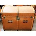 A large late Victorian wooden battened canvas trunk, the hinged domed top enclosing a lift-out tray,