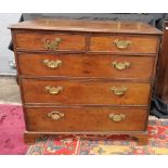 A George III oak chest, the moulded rectangular top above two short and three long drawers,