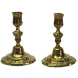 A pair of brass silver shape candlesticks, in late 17th century style,