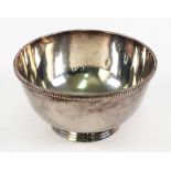 A George II style silver circular bowl, Edward Barnard & Sons, London 1926, with beaded border,