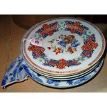 A Chinese famille-rose plate, Qianlong, painted with a central vase, bowl of fruit and flowers,