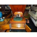 A mid-20th century oak carved table top gramophone.