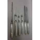 A silver handled five piece carving set, comprising; two carving knives,