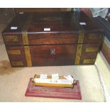 A George IV rosewood and brass mounted jewellery box and a desk calendar, (2).