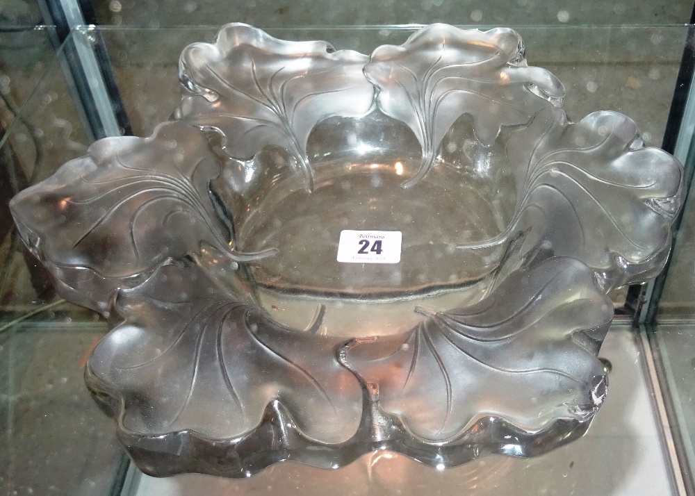 A Lalique bowl, decorated with floral rim, 'Lalique France' etched to base, 31cm dia.