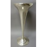 An American Sterling trumpet shaped vase, initial engraved, raised on a loaded circular foot,