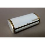 A Russian Faberge silver gilt and enamelled, hinge lidded cigarette box, of oval section form,